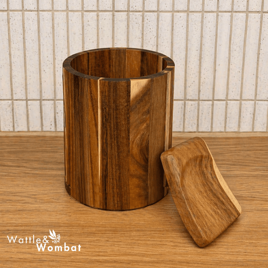 Teak Kitchen Caddy with wooden spoon rest on wooden surface